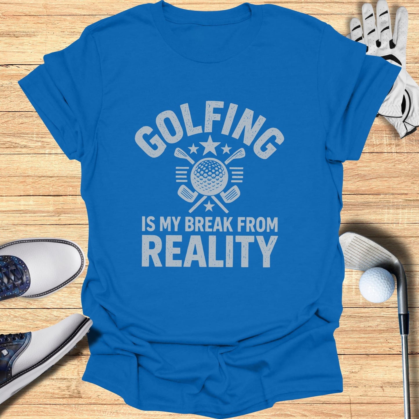 Blue t-shirt with "Golfing is my break from reality" text and golf club graphic.