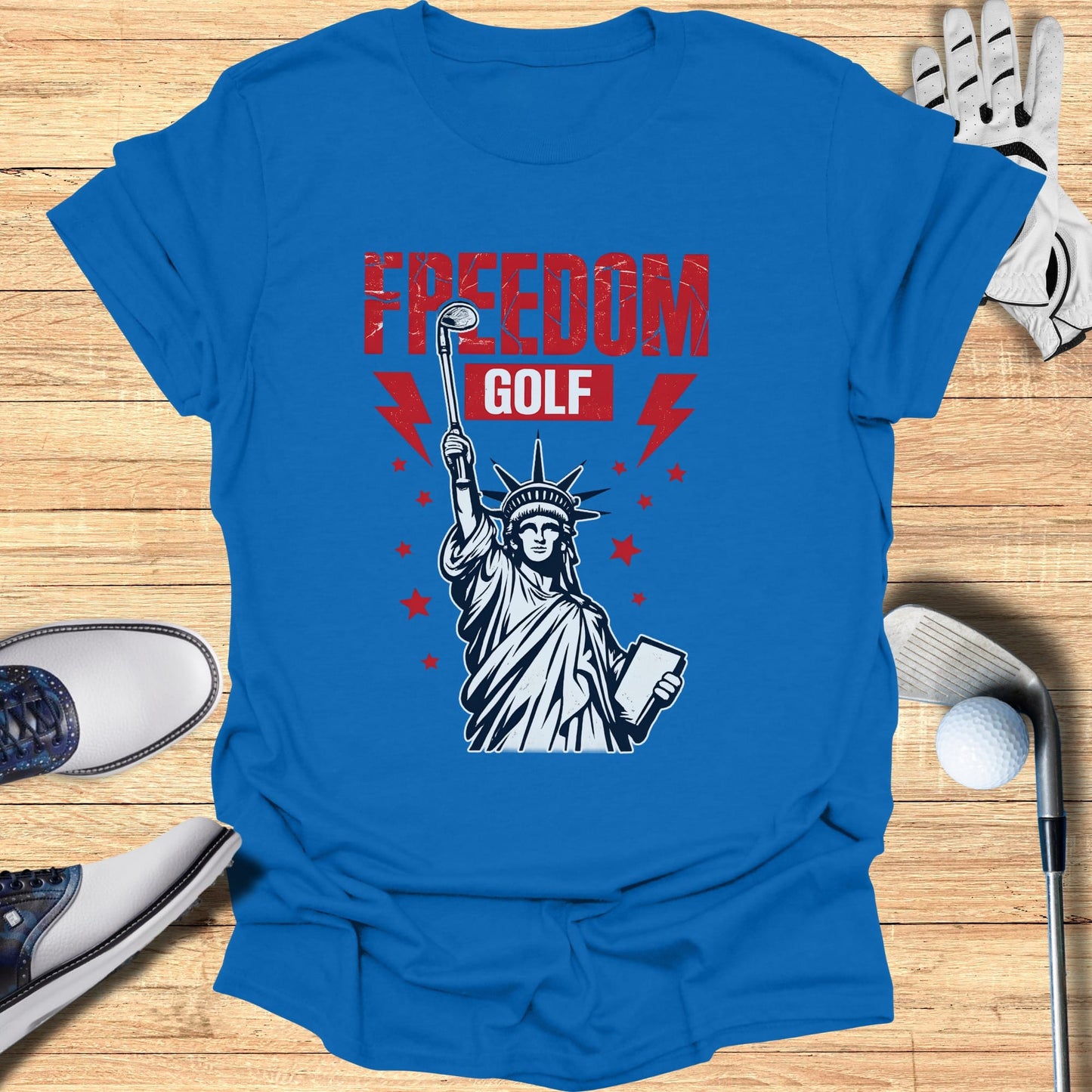 Statue of Liberty holding golf club and golf ball, "Freedom Golf" text.