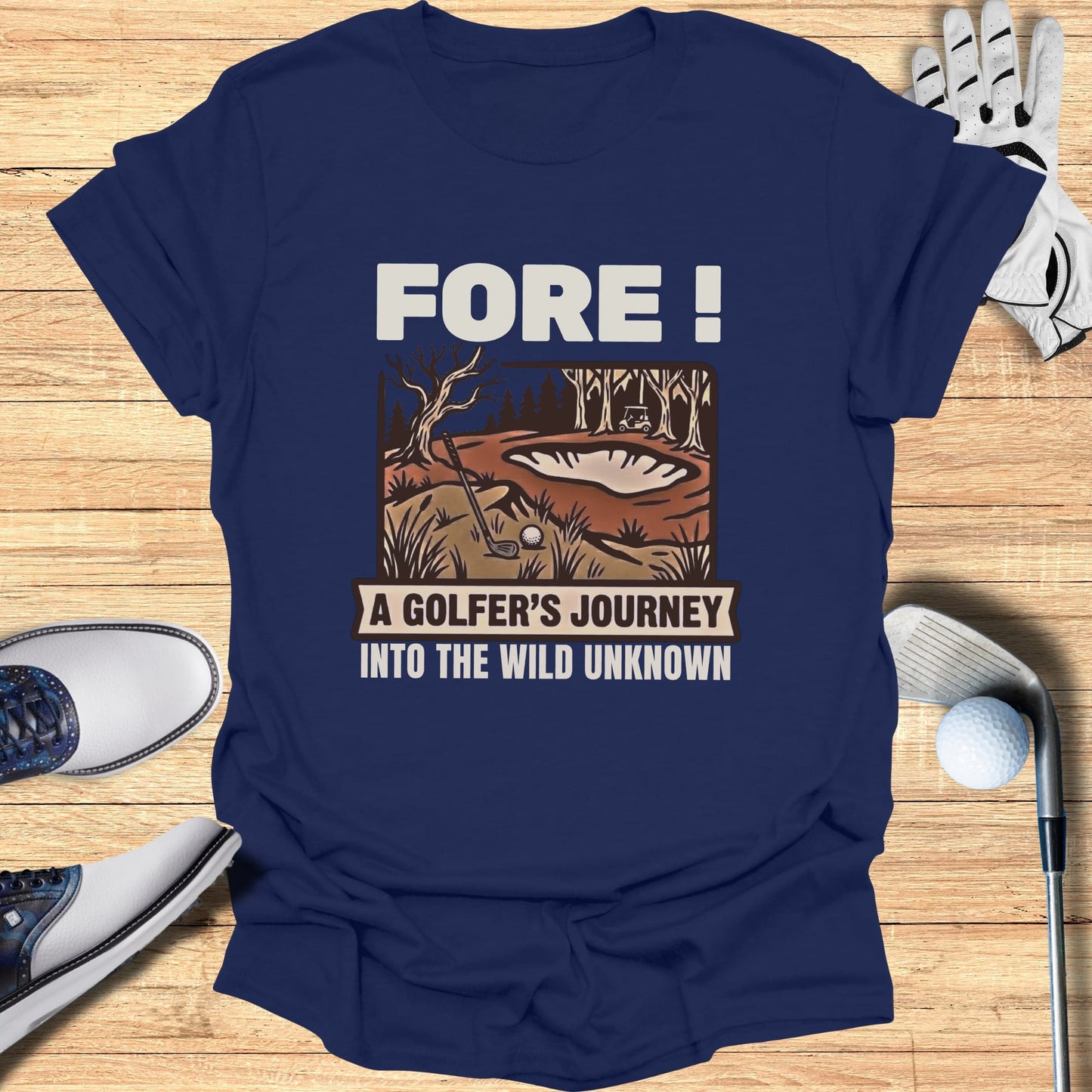 Navy t-shirt with "Fore! A Golfer's Journey Into The Wild Unknown" and golf graphic.