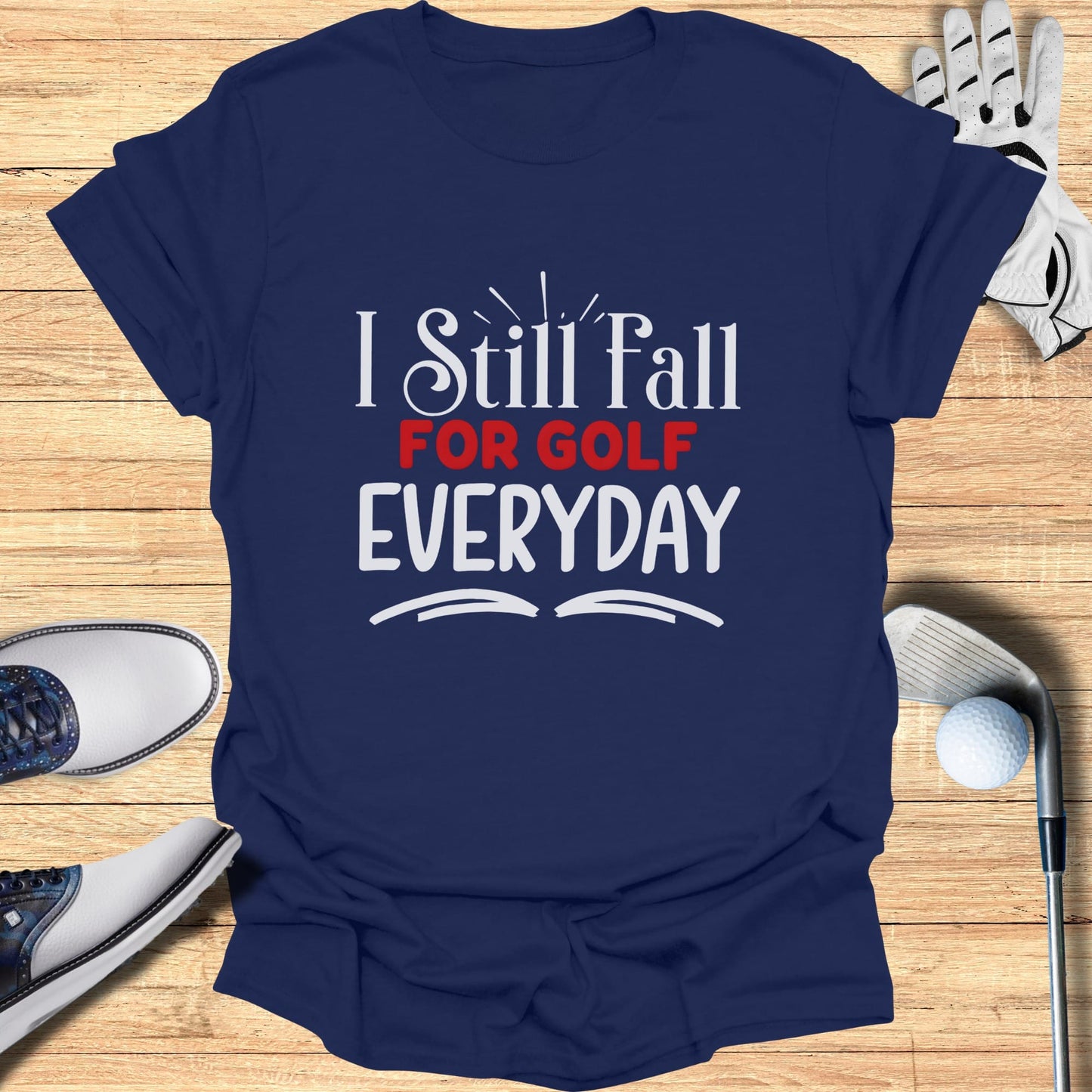 Navy t-shirt with "I Still Fall For GOLF EVERYDAY" text.