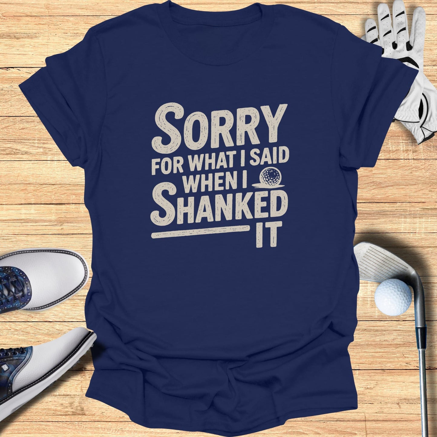 Navy t-shirt with "Sorry for what I said when I shanked it" graphic.