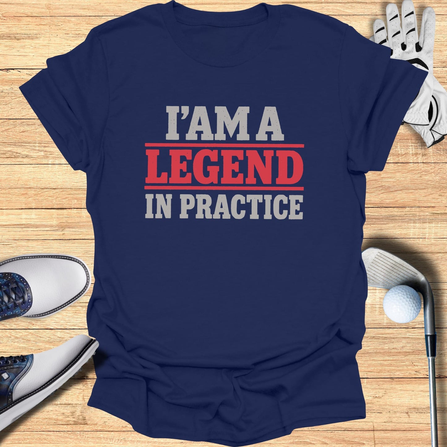 Navy t-shirt with "I AM A LEGEND IN PRACTICE" text in red and white.