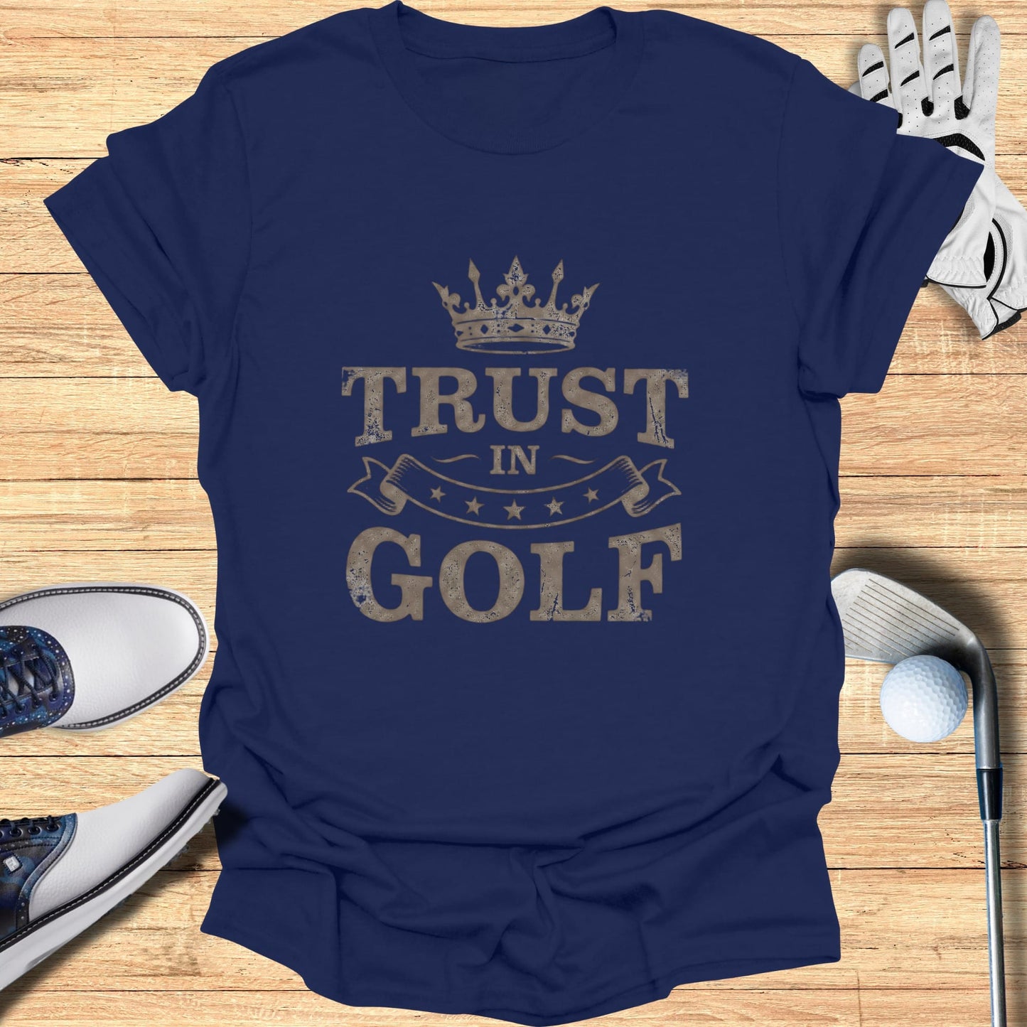 Navy t-shirt with "Trust in Golf" text and crown graphic.