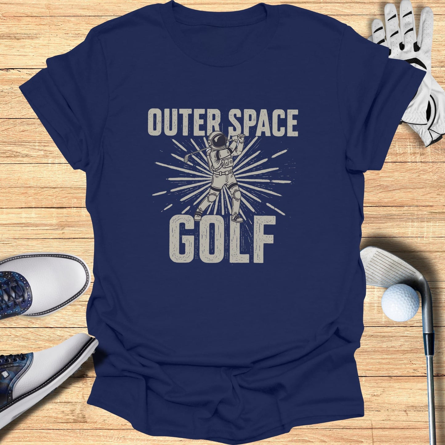 Navy t-shirt with "Outer Space Golf" graphic of astronaut golfing.