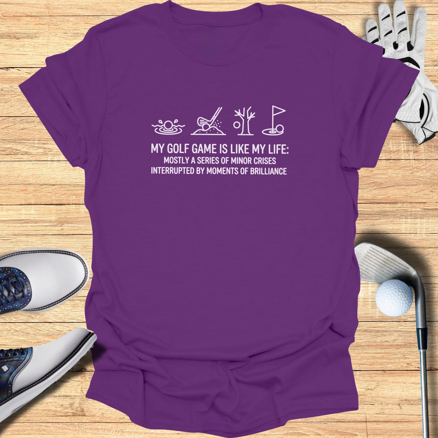 T-shirt with "My golf game is like my life" text and golf icons.