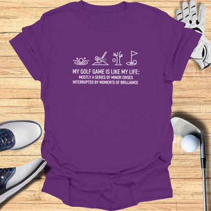 T-shirt with "My golf game is like my life" text and golf icons.