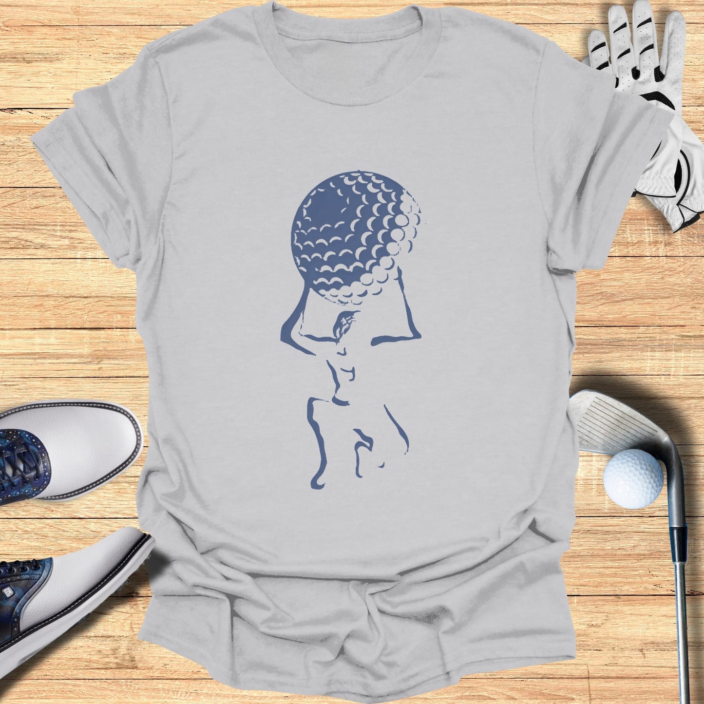 Gray t-shirt with stylized golfer carrying a golf ball, golf clubs, and shoes.