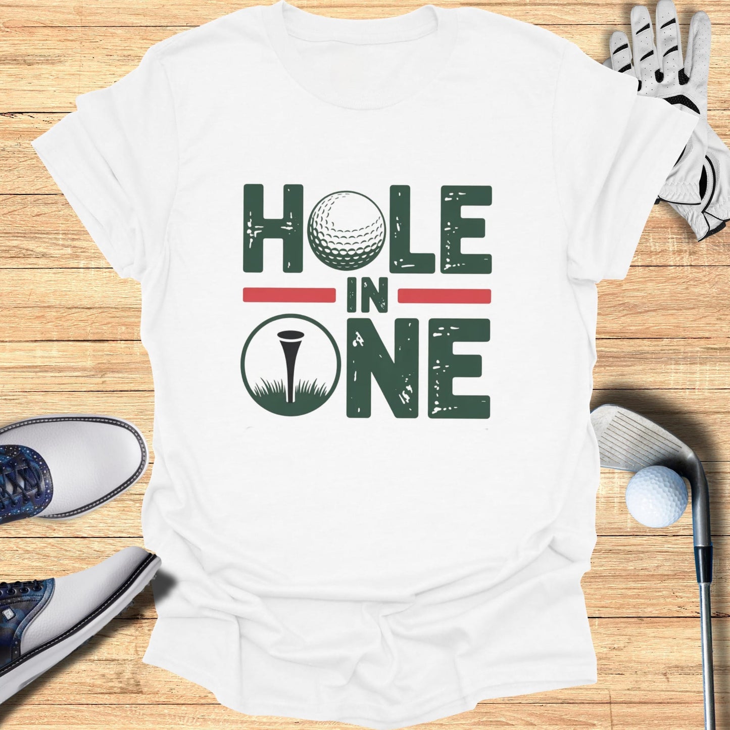 White t-shirt with "Hole in One" text and golf ball graphic.