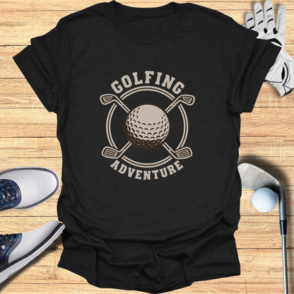 Black t-shirt with circular golf graphic featuring clubs, ball, and text.
