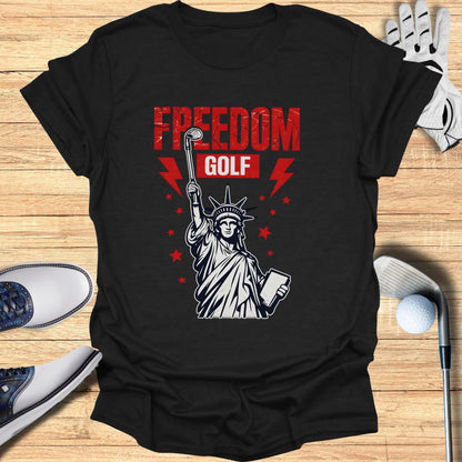 T-shirt with Statue of Liberty holding a golf club and book, "Freedom Golf" text.