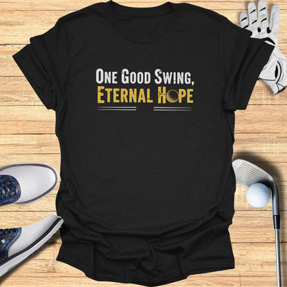 Black t-shirt with "One Good Swing, Eternal Hope" and golf imagery.