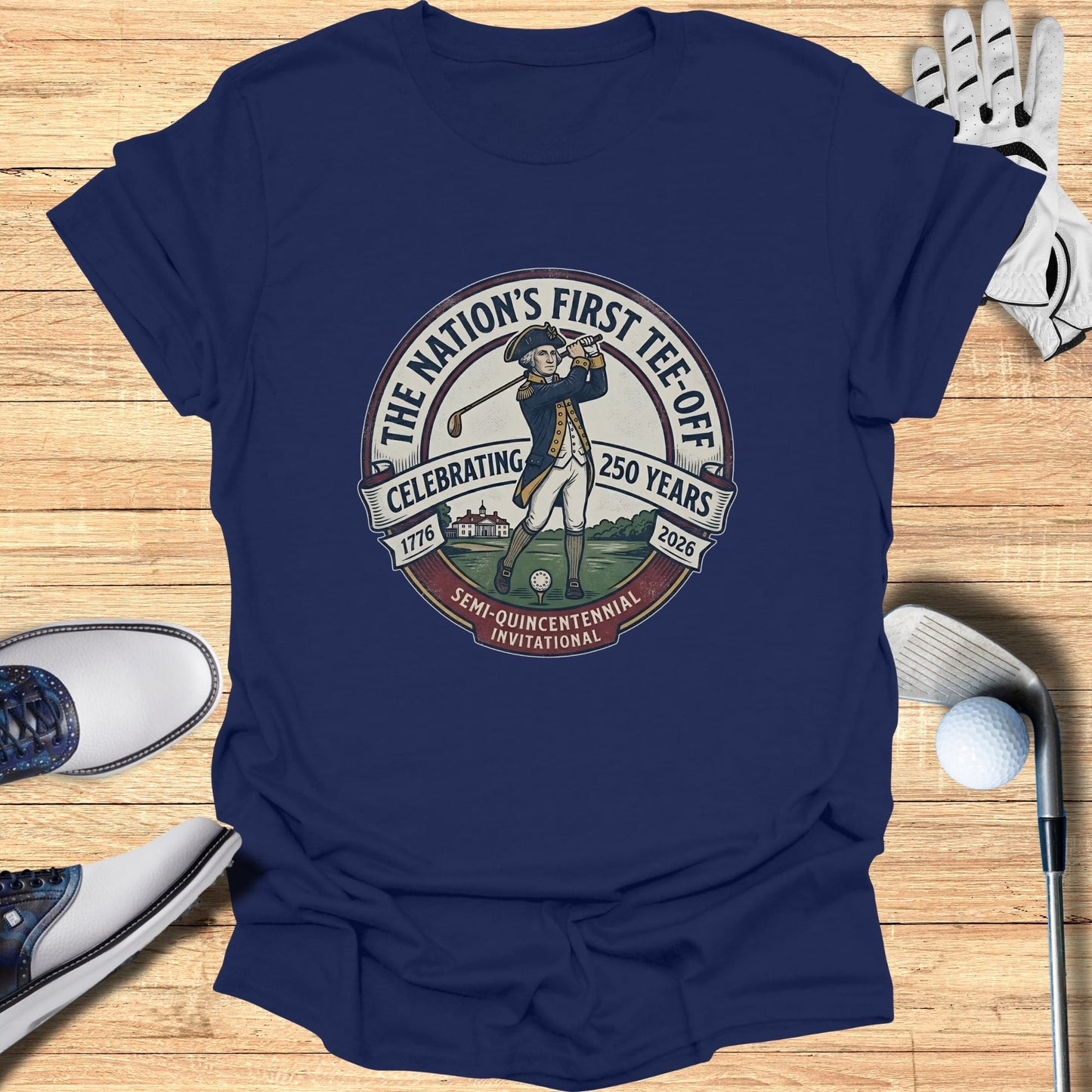 Navy t-shirt with "The Nation's First Tee-Off" 250th anniversary golf graphic.