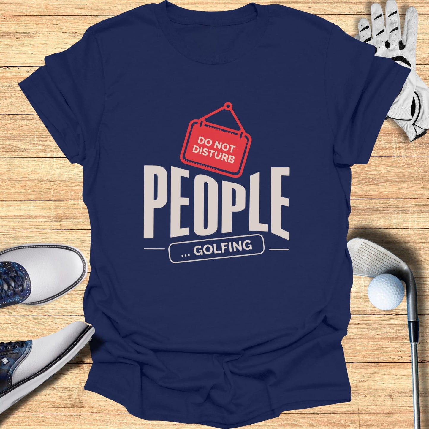 Navy t-shirt with "DO NOT DISTURB ... GOLFING" text and golf accessories.