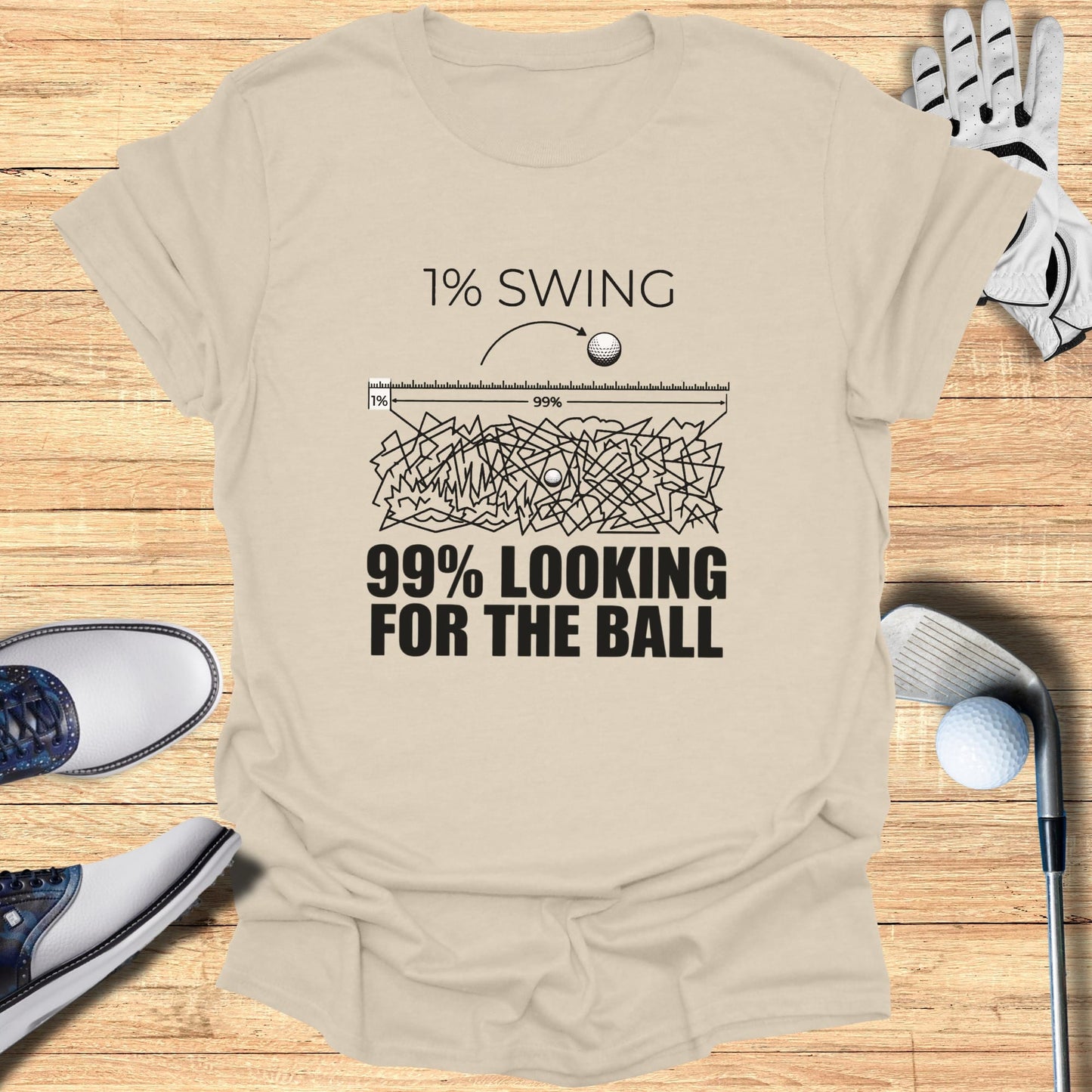 T-shirt with "1% SWING 99% LOOKING FOR THE BALL" graphic.