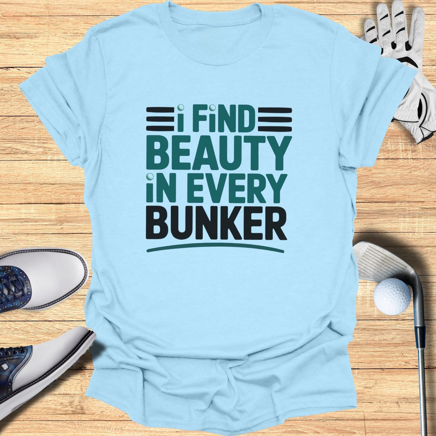 Light blue t-shirt with "I FIND BEAUTY IN EVERY BUNKER" text.
