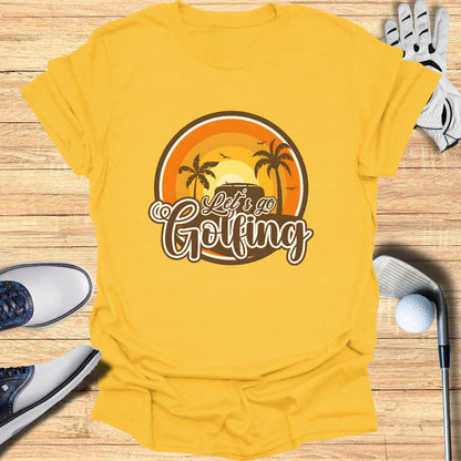 Yellow t-shirt with "Let's Go Golfing" text and a sunset golf scene.