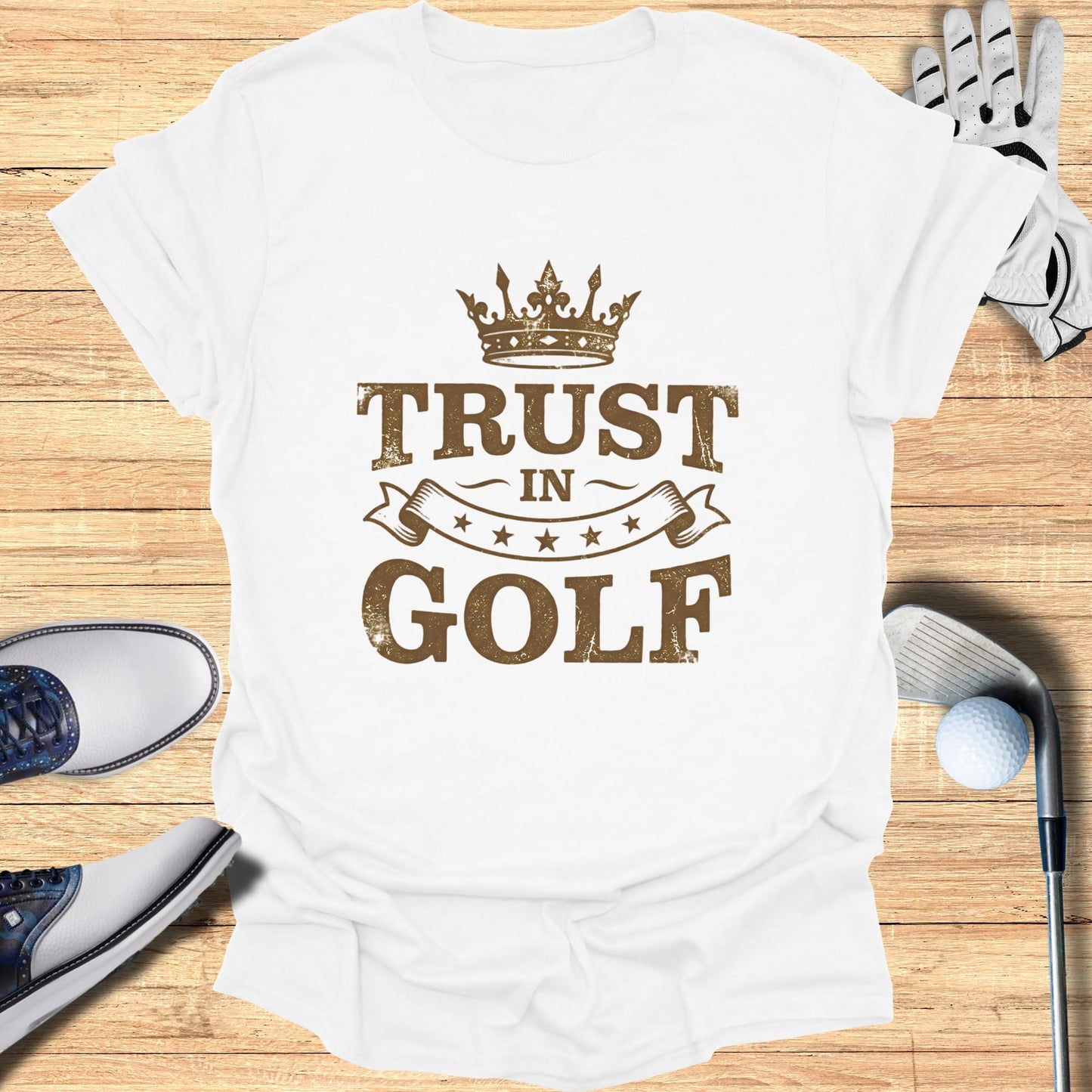 White t-shirt with "Trust In Golf" text and crown graphic.