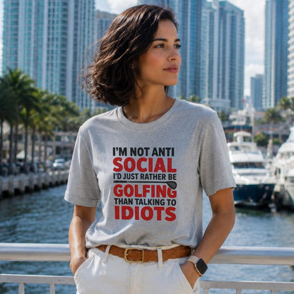Woman wearing a grey t-shirt with "I'm not anti social I'd just rather be golfing than talking to idiots" text.