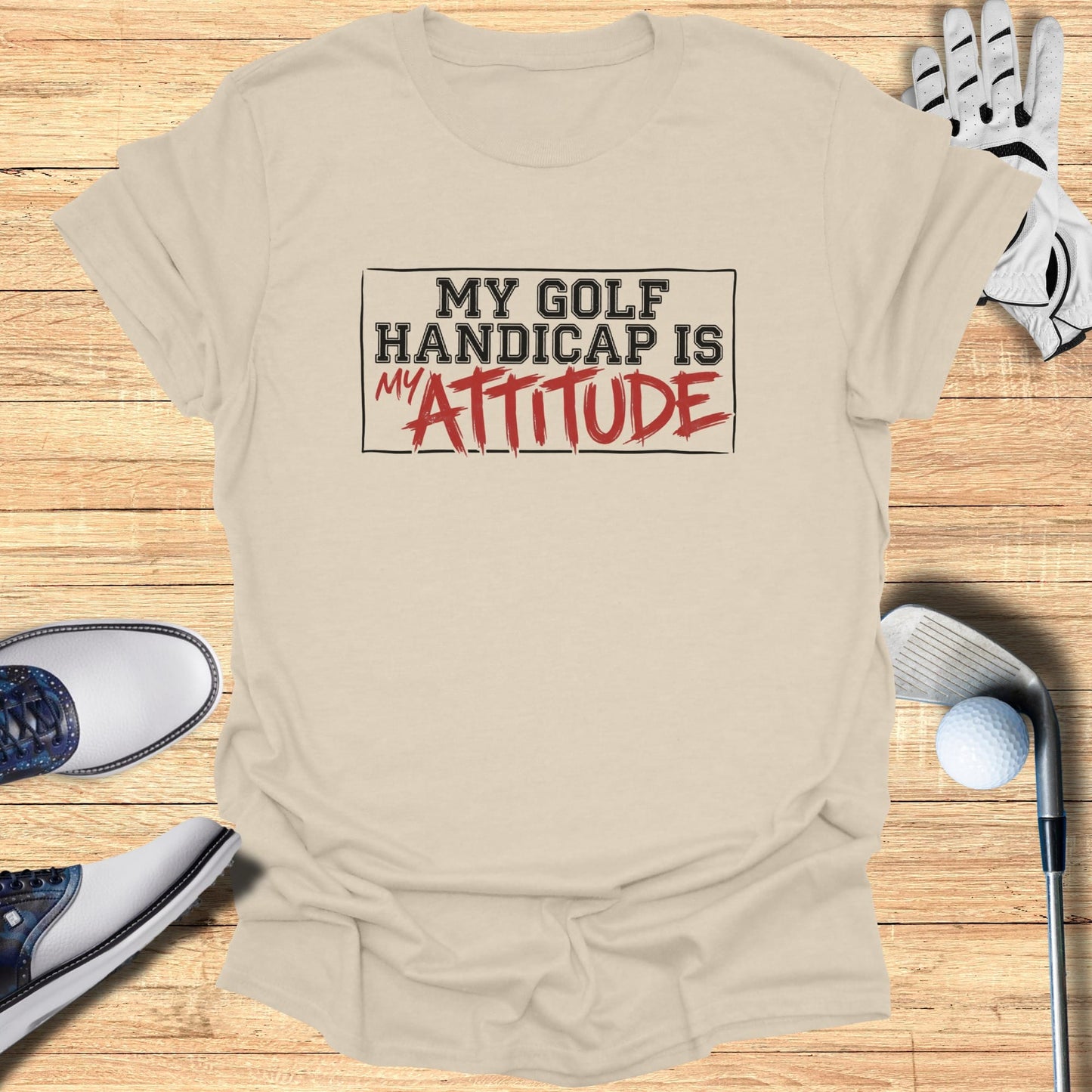 T-shirt with "My Golf Handicap is Attitude" text.