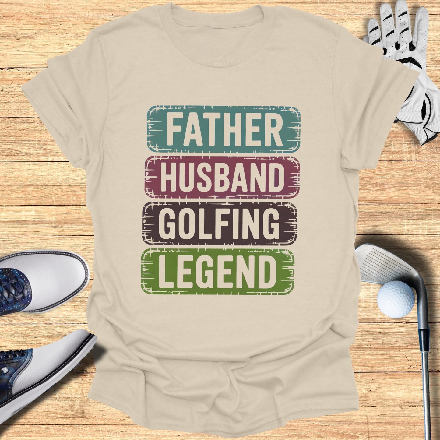 T-shirt with "Father Husband Golfing Legend" text and golf accessories.