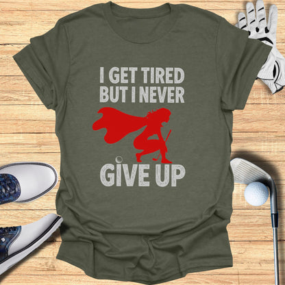 T-shirt with "I GET TIRED BUT I NEVER GIVE UP" and a superhero golfer graphic.