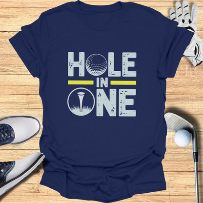 Navy t-shirt with "HOLE IN ONE" text and golf ball graphic.