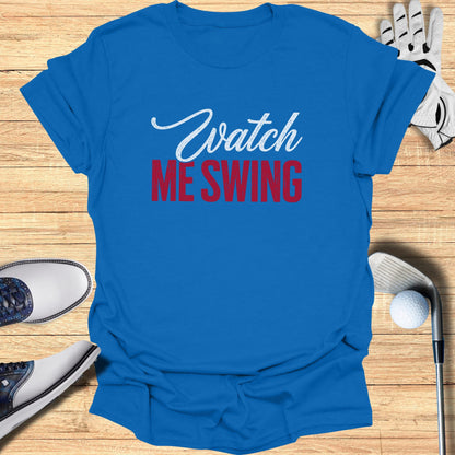 Blue t-shirt with "Watch ME Swing" text, golf clubs, and shoes.