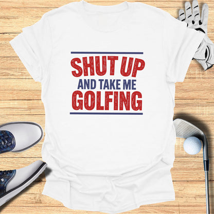 White t-shirt with "SHUT UP AND TAKE ME GOLFING" graphic.