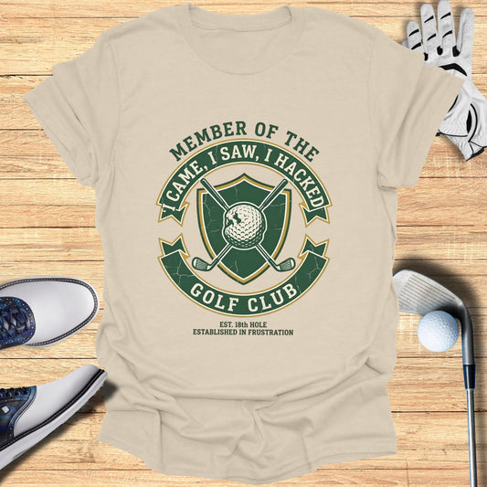 T-shirt with "Member of the Golf Club" crest and golf equipment.