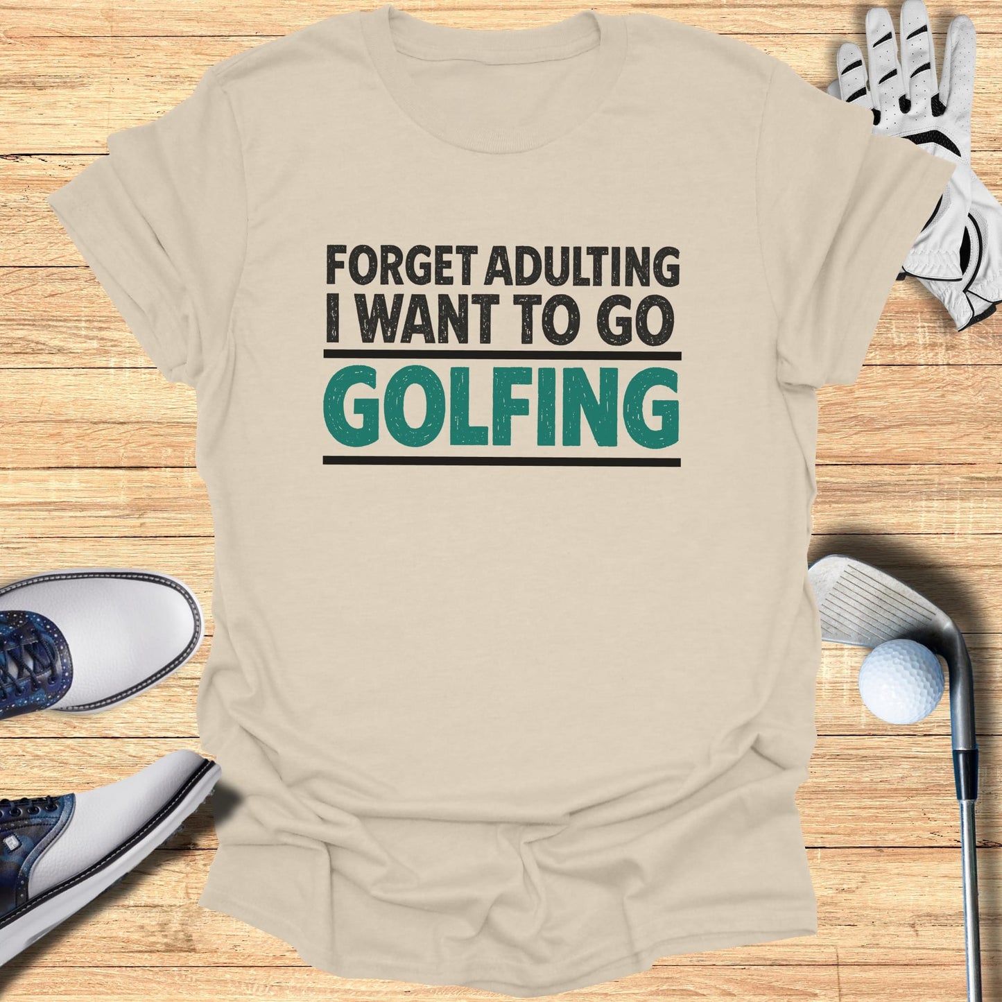 Light beige t-shirt with "Forget adulting I want to go GOLFING" text.