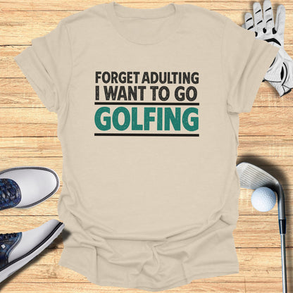 Light beige t-shirt with "Forget adulting I want to go GOLFING" text.