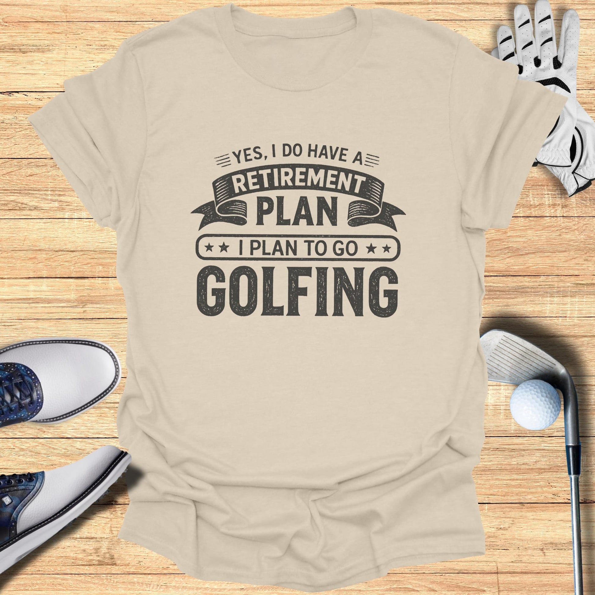 Light tan t-shirt with "Yes, I do have a retirement plan I plan to go golfing" text.