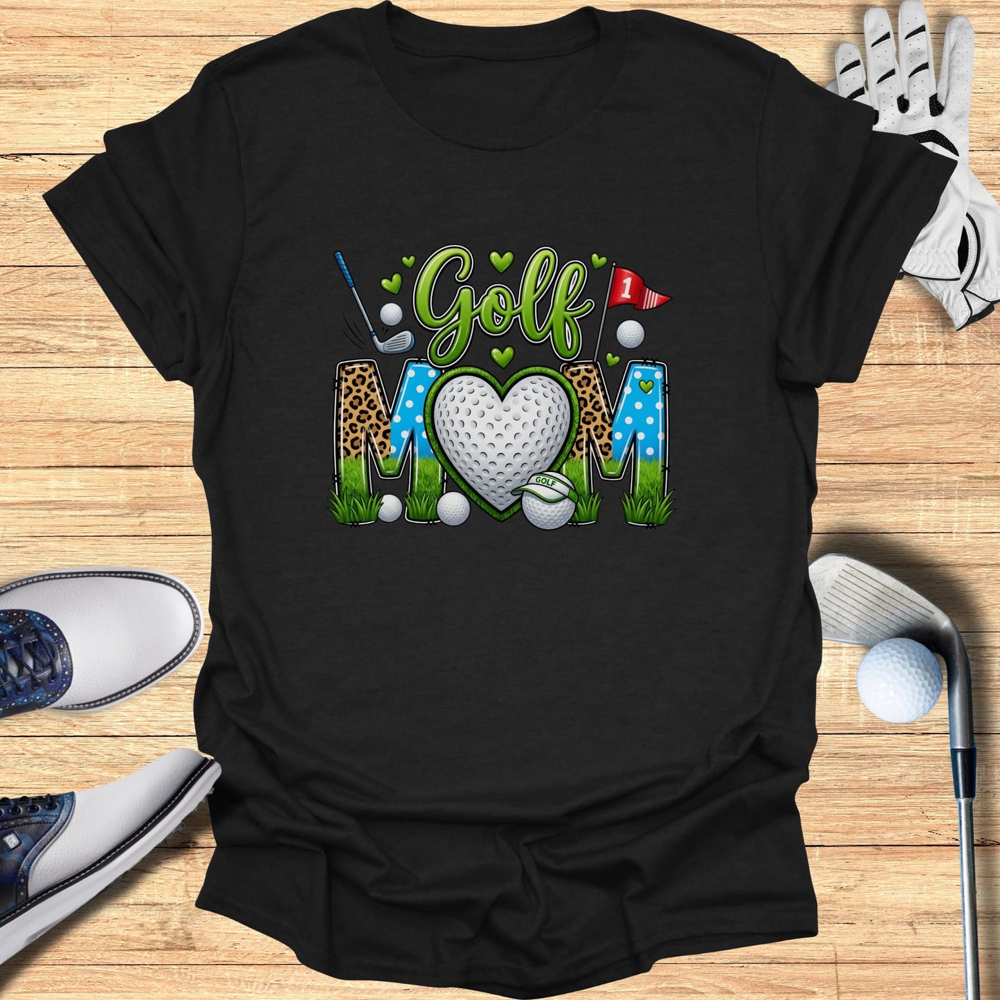 Black t-shirt with "Golf Mom" in colorful lettering and a heart graphic.