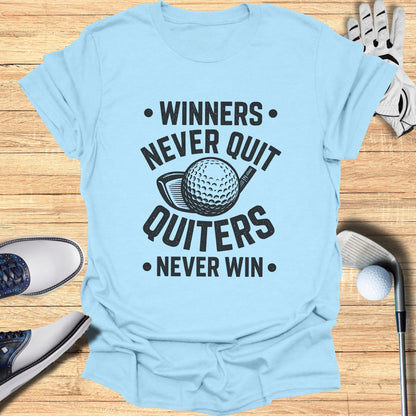 Light blue t-shirt with "Winners Never Quit, Quitters Never Win" and golf ball graphic.