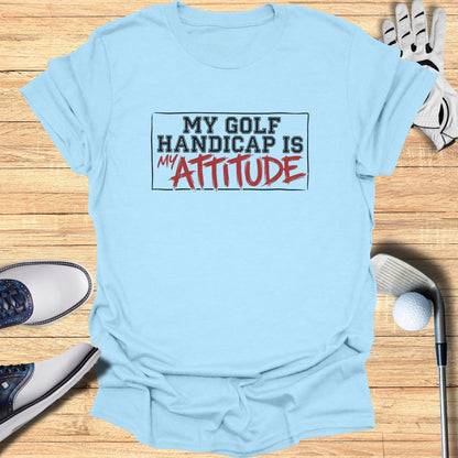 Light blue t-shirt with "My Golf Handicap Is My Attitude" text.