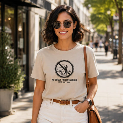 Woman wearing t-shirt with "No Buggy Path Standing Drive, Don't Talk" text and graphic.