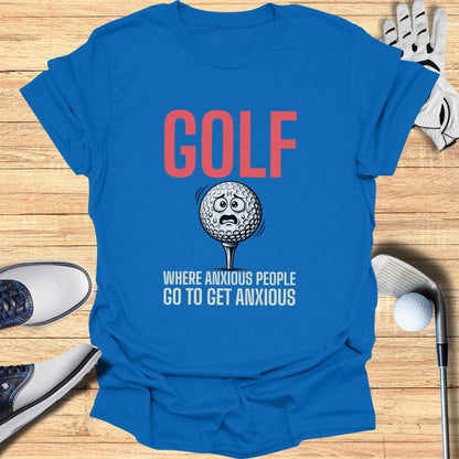 Blue t-shirt with "GOLF WHERE ANXIOUS PEOPLE GO TO GET ANXIOUS" and worried golf ball.