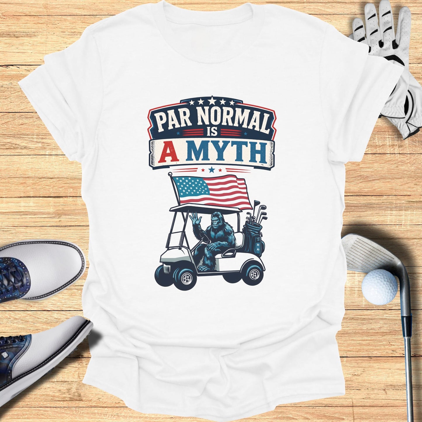 Bigfoot in a golf cart with American flag and text "Par Normal Is A Myth".