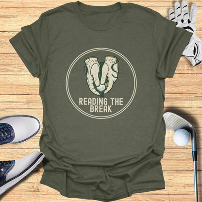 Green t-shirt with "Reading the Break" text and golf gloves graphic.