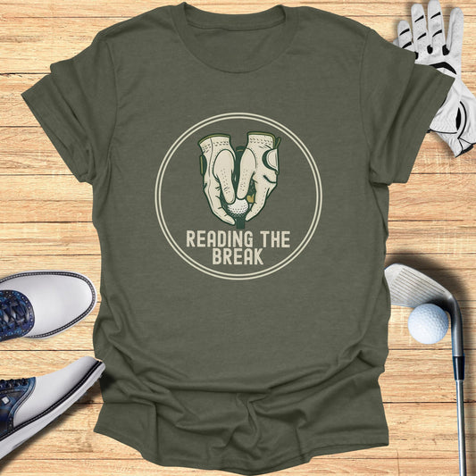 Green t-shirt with "Reading the Break" text and golf gloves graphic.