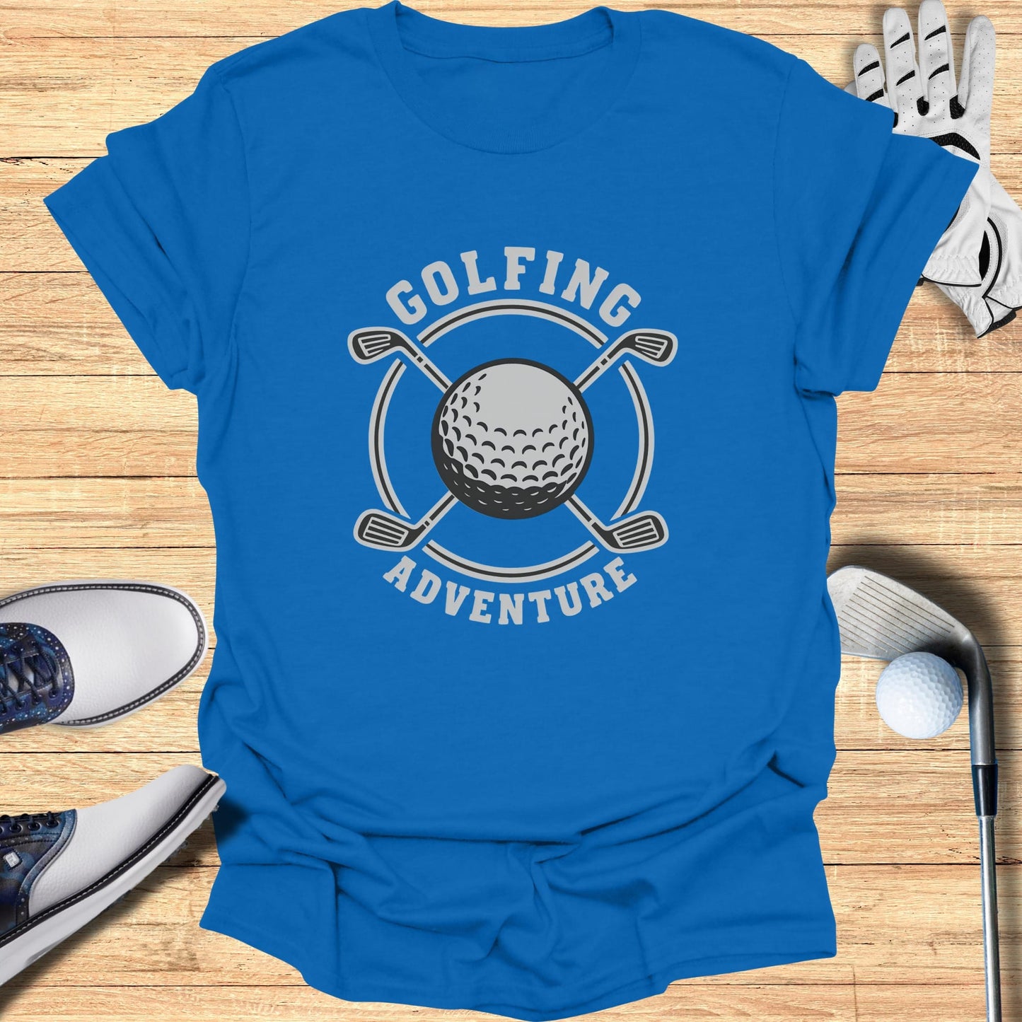 Blue t-shirt with "GOLFING ADVENTURE" text and golf ball emblem.