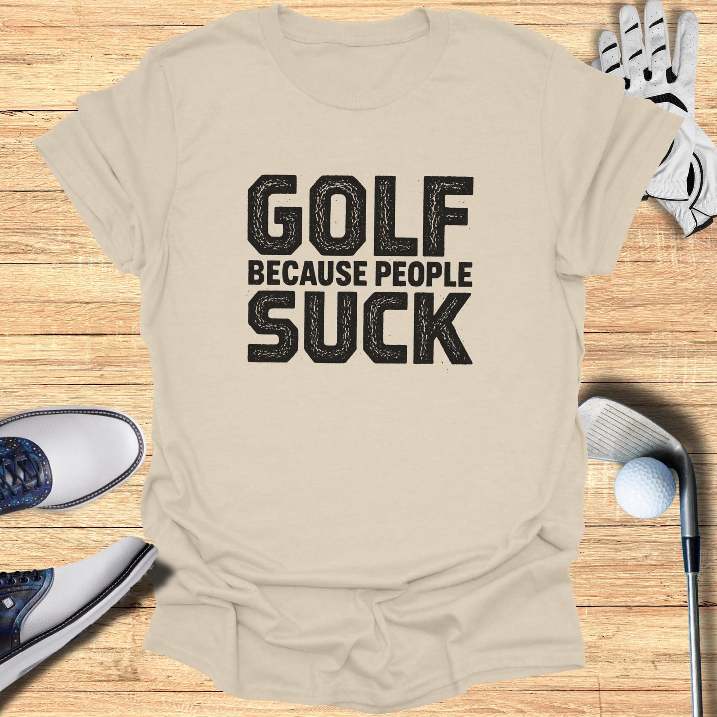 Beige t-shirt with black text "GOLF BECAUSE PEOPLE SUCK".