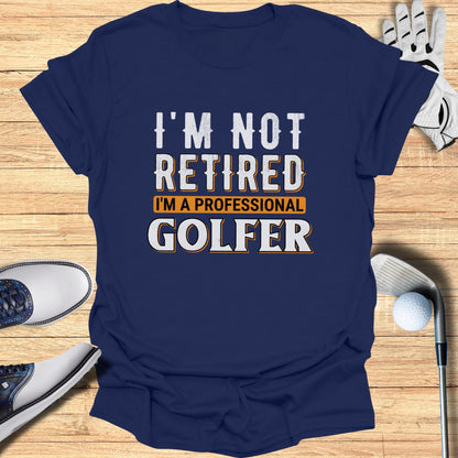 Navy t-shirt with "I'm not retired I'm a professional golfer" text.