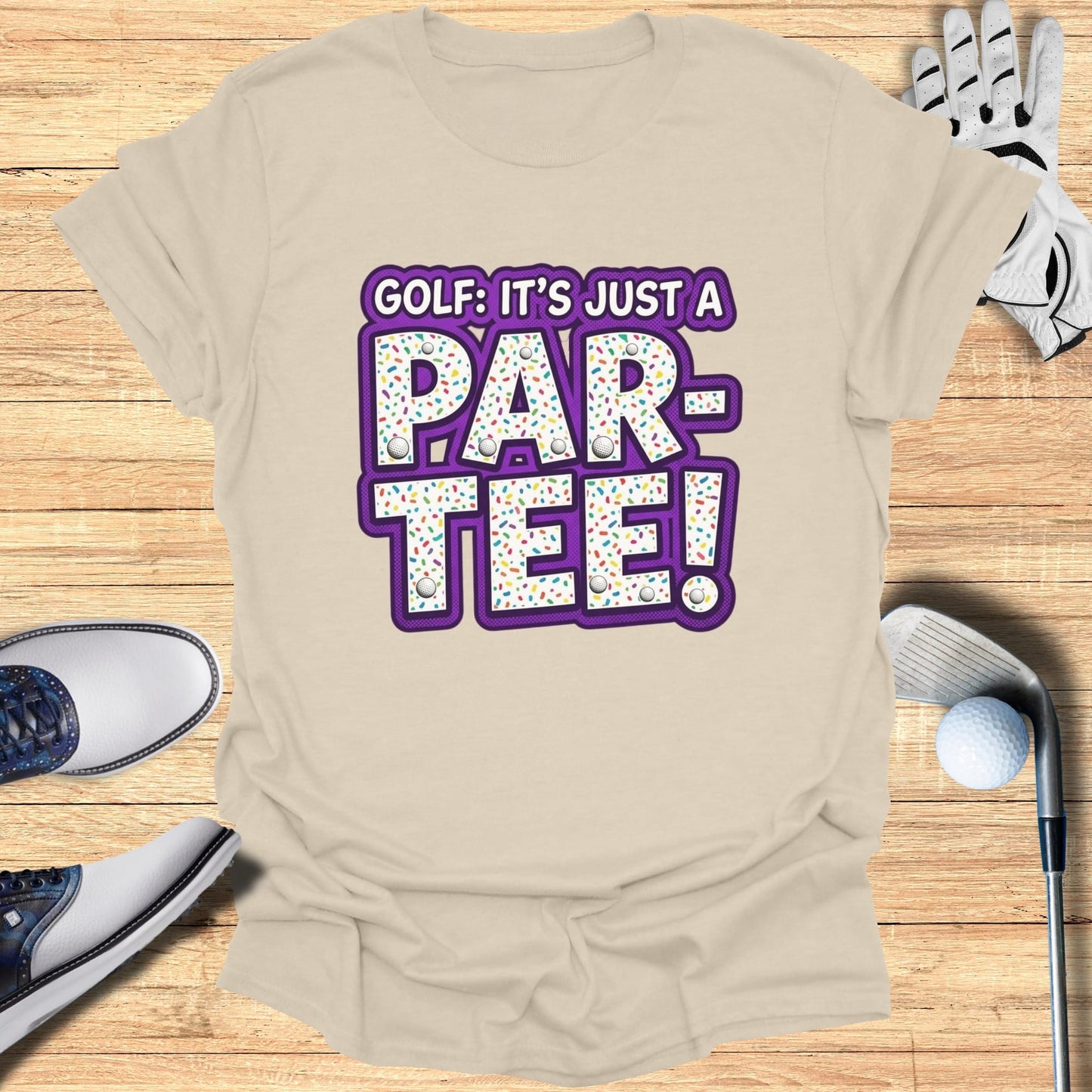 Beige t-shirt with "Golf: It's Just a Par-Tee!" text and sprinkles.