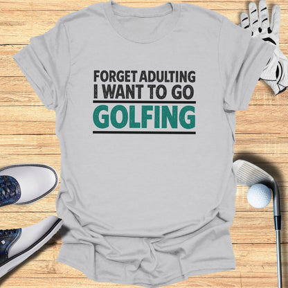 Light gray t-shirt with "Forget Adulting I Want To Go Golfing" text.
