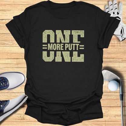 Black t-shirt with "ONE MORE PUTT" text in distressed gold letters.