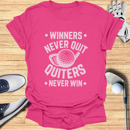 Pink t-shirt with "Winners Never Quit Quitters Never Win" and golf ball design.