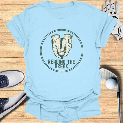 Light blue t-shirt with "Reading the Break" golf logo.