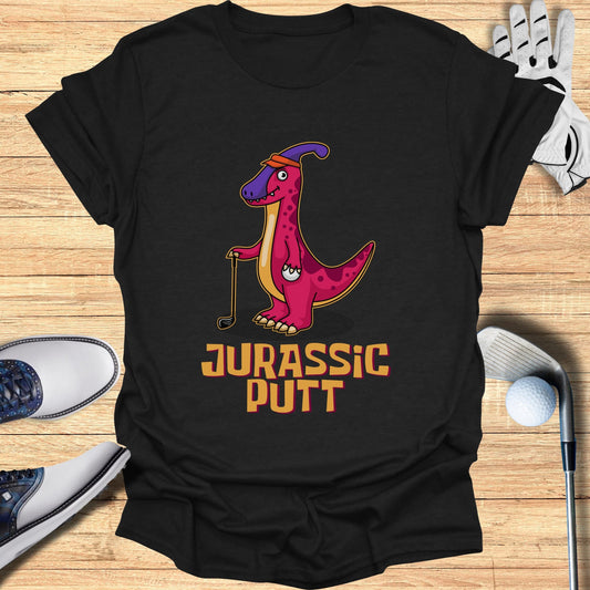 Black t-shirt with a cartoon pink dinosaur playing golf, text "JURASSIC PUTT".