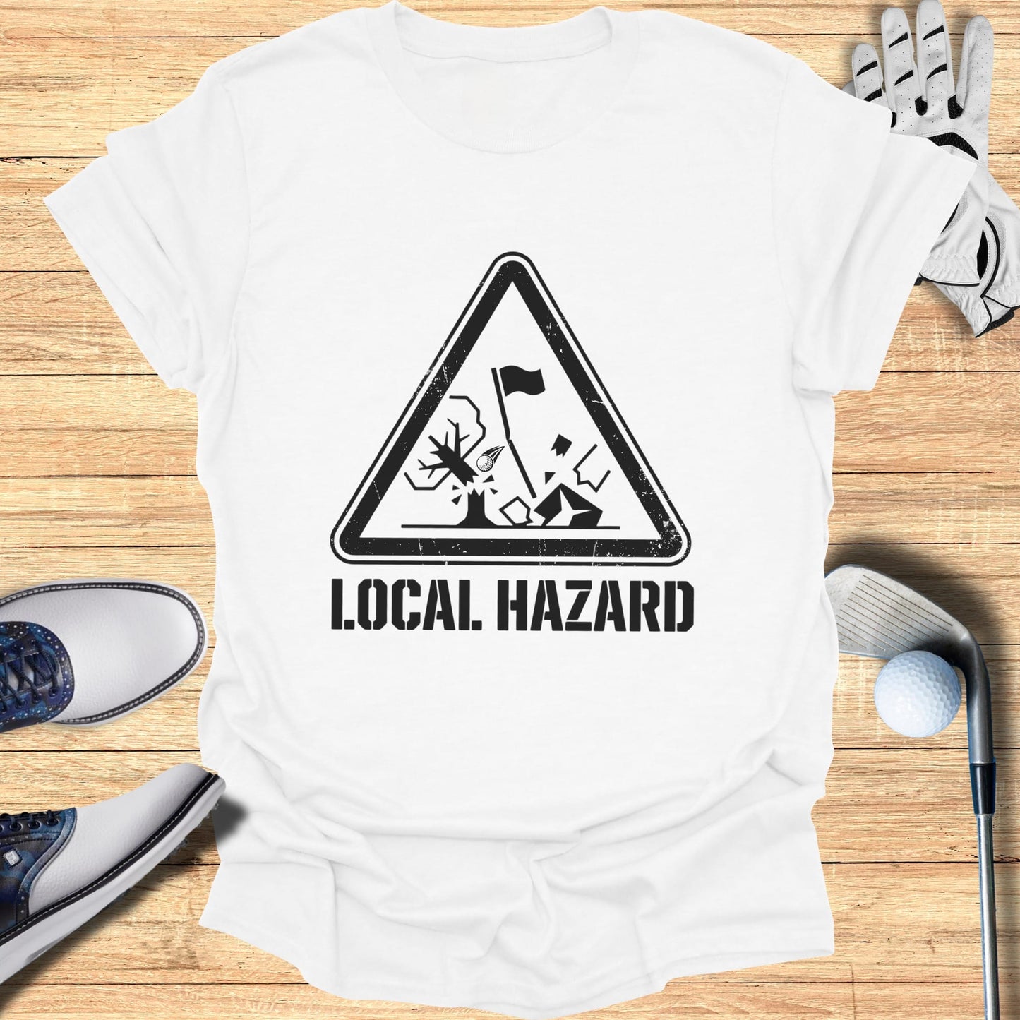 White t-shirt with "LOCAL HAZARD" golf warning sign graphic.